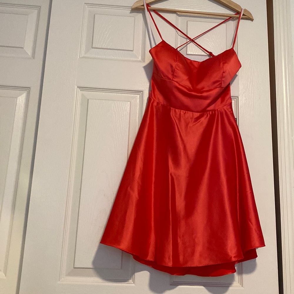 Party/homecoming/prom dress. Color reddish orange. Size 9/10 juniors. Laced back